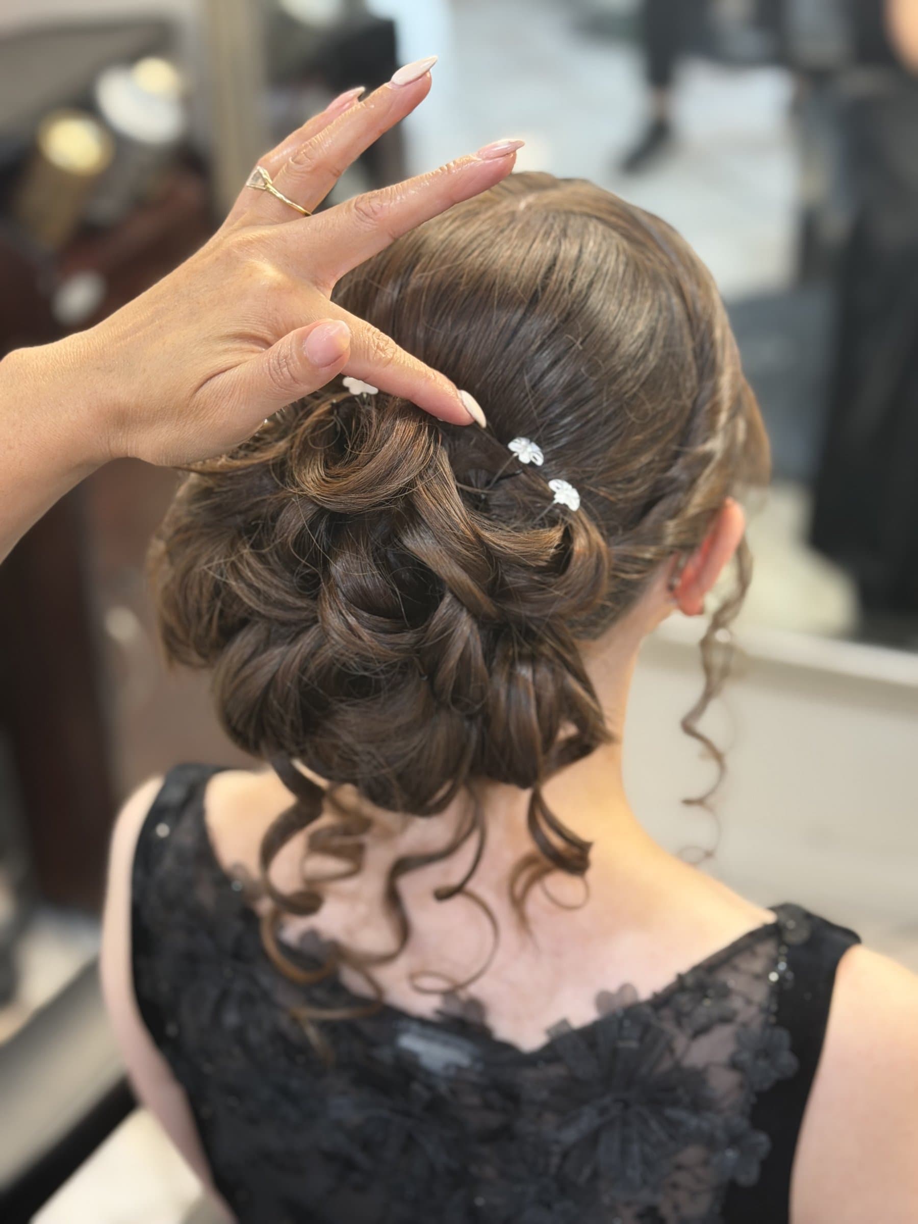 Elegant bridal updo styling at JBELLA Hair Salon